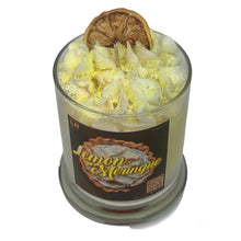 Load image into Gallery viewer, Lemon Meringue dessert scented candle with a white whipped topping dried lemon slice and finished with gold and yellow biodegradable glitter. 
